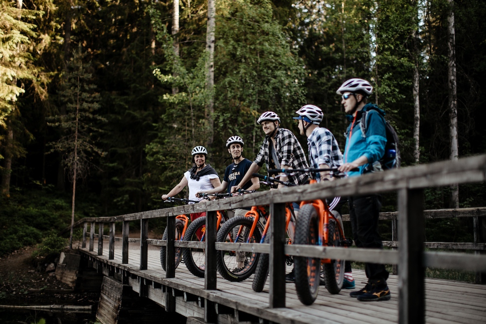 Natura Viva Visit Espoo - bikers on a bridge in Nuuksio